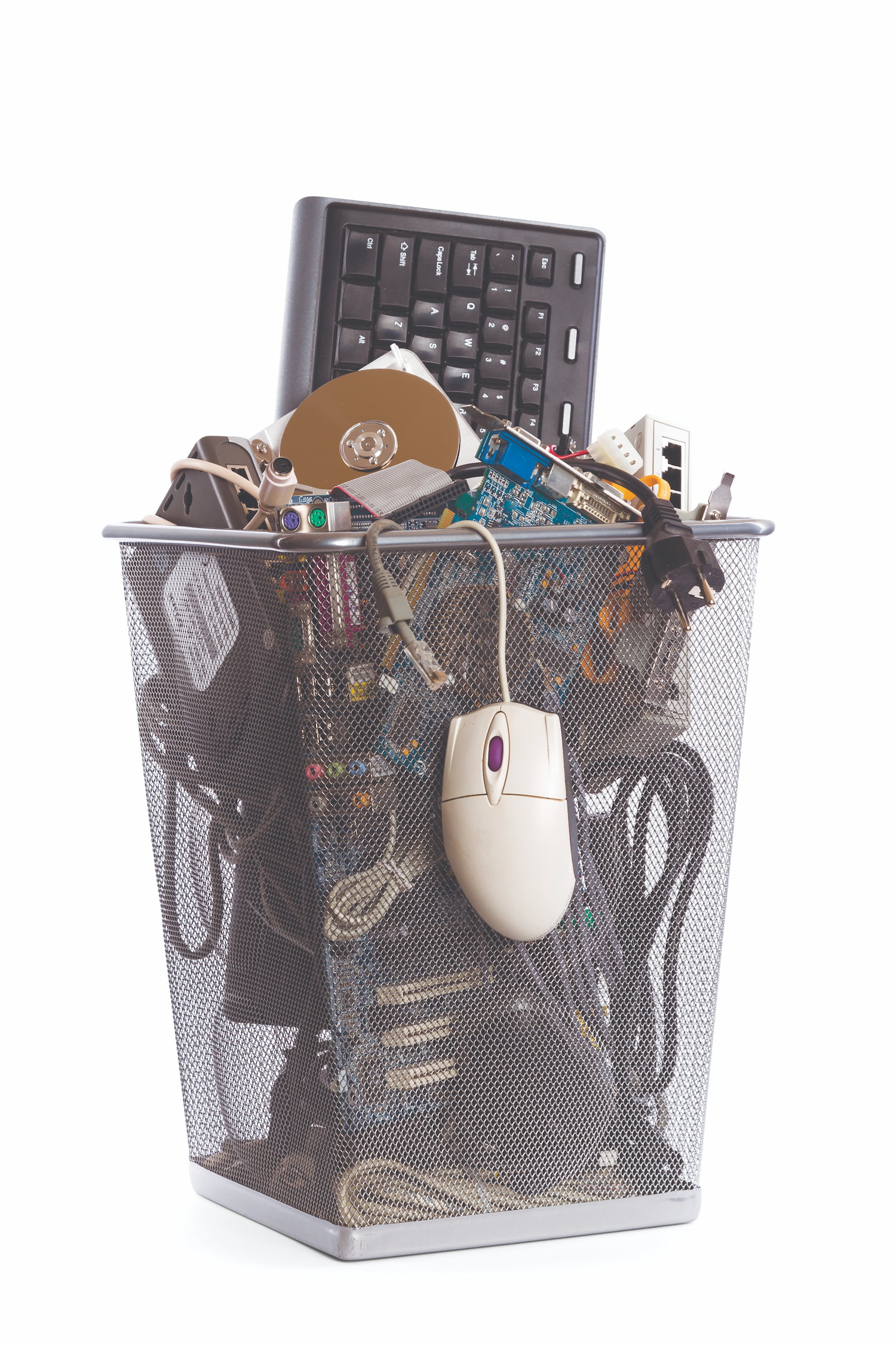 A transparent trash can filled with electronic waste